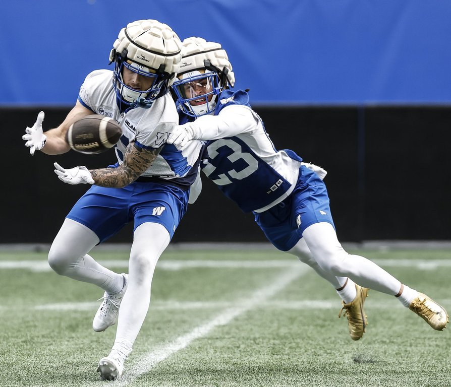 Winnipeg Blue Bombers' Trey Vaval (23) defends against Joey Corcoran (81) during their CFL football training camp in Winnipeg on Monday, May 11, 2026. THE CANADIAN PRESS/John Woods.