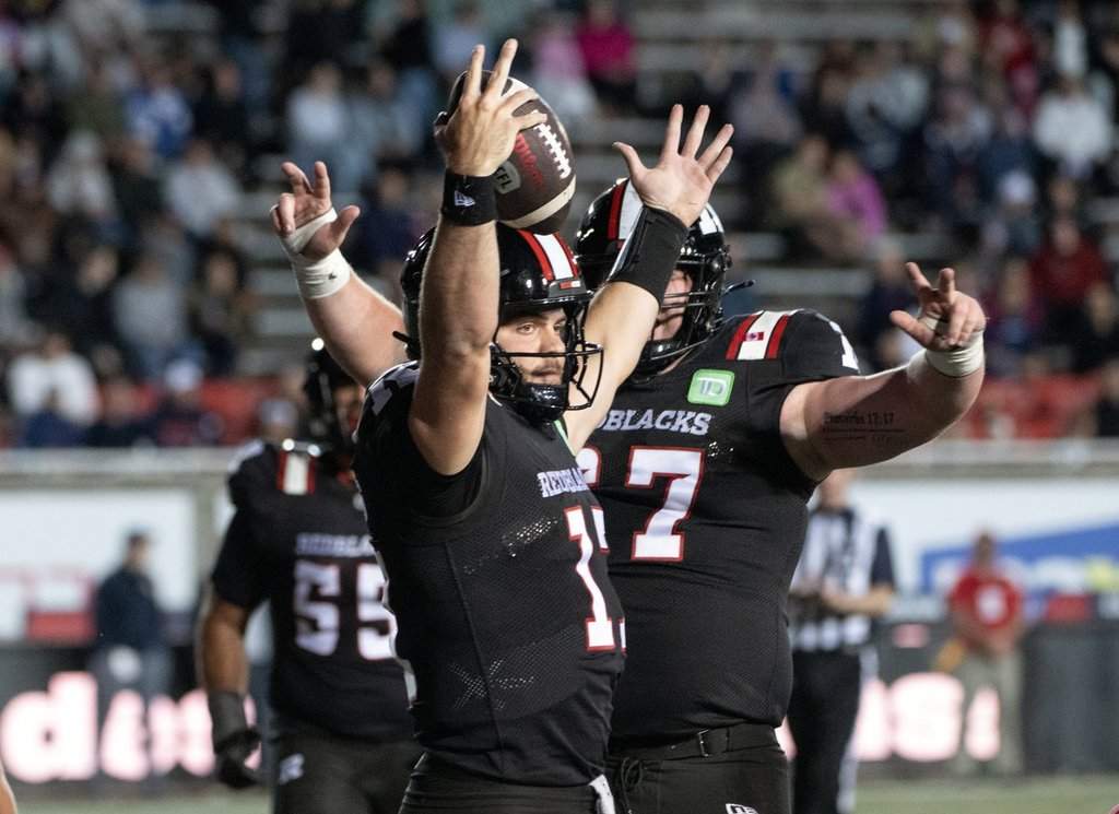 Ottawa Redblacks quarterback Bryson Barnes celebrates his touchdown late in the second half of CFL preseason football action against the Montreal Alouettes in Montreal Friday May 22, 2026. THE CANADIAN PRESS/Peter McCabe.