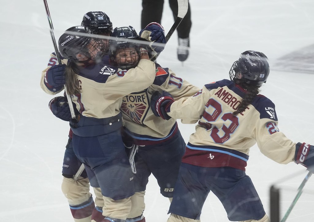 Montreal Victoire forward Abby Roque (11) celebrates her goal against the Ottawa Charge with teammates during third period PWHL Walter Cup final hockey action in Ottawa, Wednesday, May 20, 2026. THE CANADIAN PRESS/Adrian Wyld