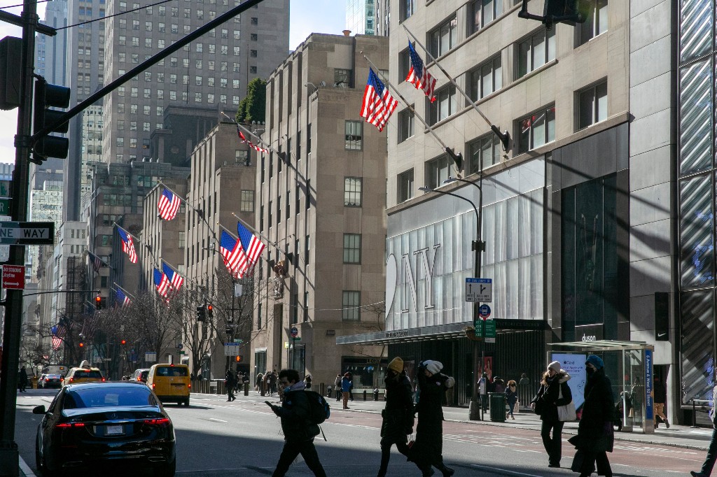 A file photo of American flags waving in the wind on Fifth Avenue in the borough of Manhattan in New York City on Friday, Jan. 21, 2022.