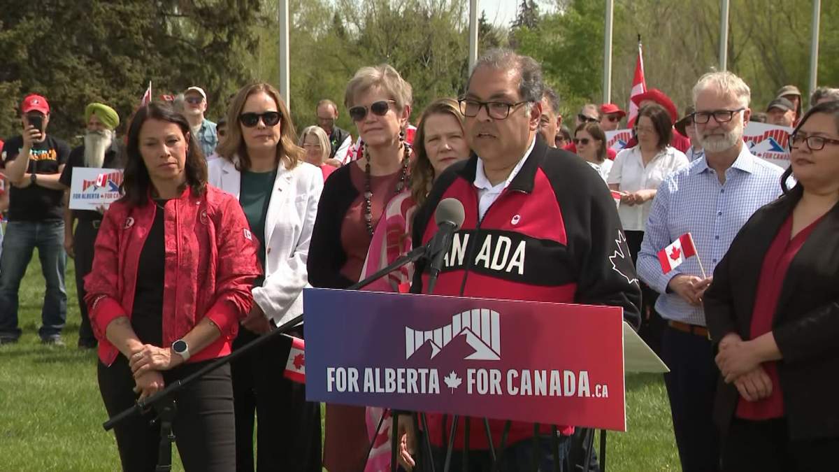 Surrounded by dozens of supporters dressed in red and white and waving Canadian flags, including retired Olympian Catriona Le May Doan, Alberta's NDP leader accused the Premier of "gaslighting" voters.