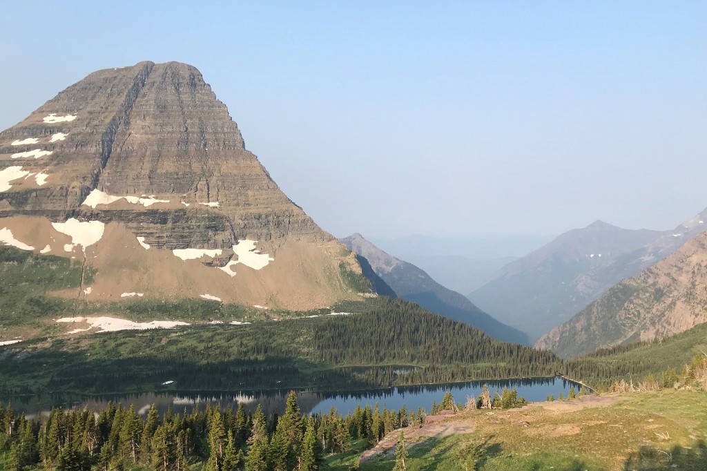 Mount Brown, second peak from left, is tucked behind Bearhat Mountain, far left, at Glacier National Park on Aug. 1, 2018, in West Glacier, Mont.