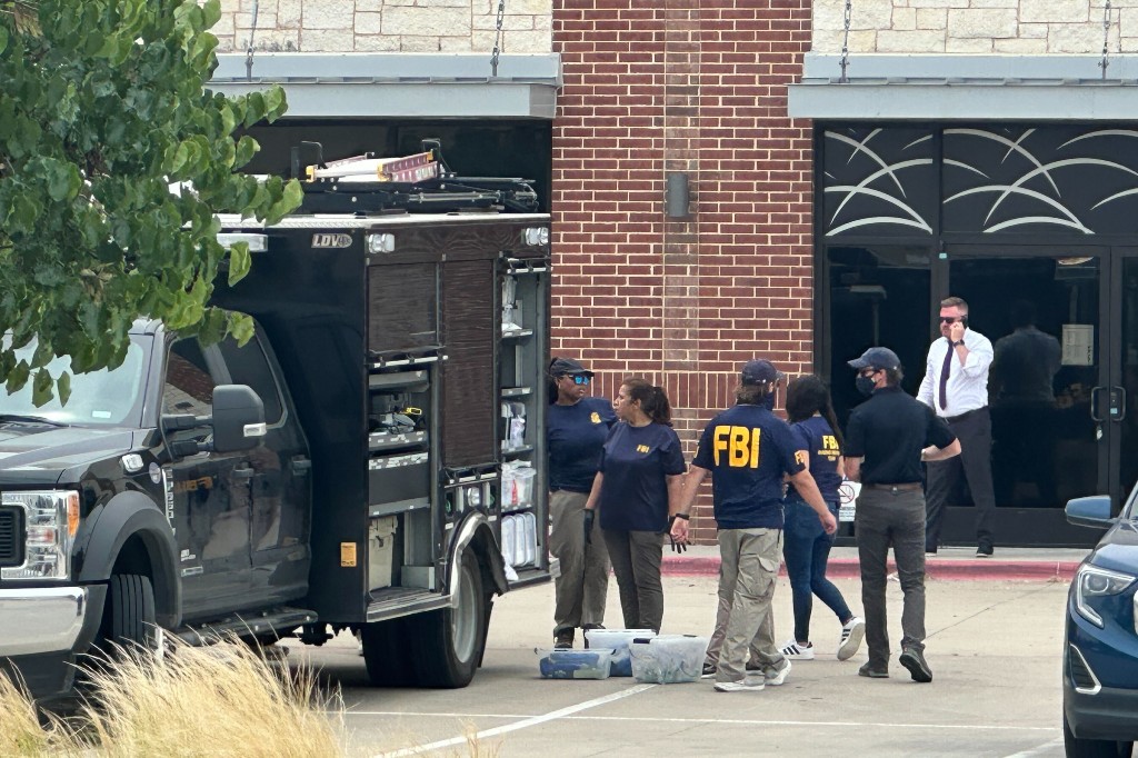 Law enforcement responds to the scene of a shooting Tuesday, May 5, 2026, at K Towne Plaza in Carrollton, Texas.