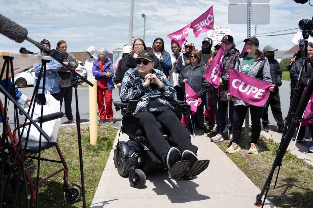 Carl Snyder, a resident at Ocean View Continuing Care Centre, joins striking long-term care workers rallying on a picket line in Eastern Passage, N.S. on Tuesday, June 2, 2026. THE CANADIAN PRESS/Darren Calabrese.