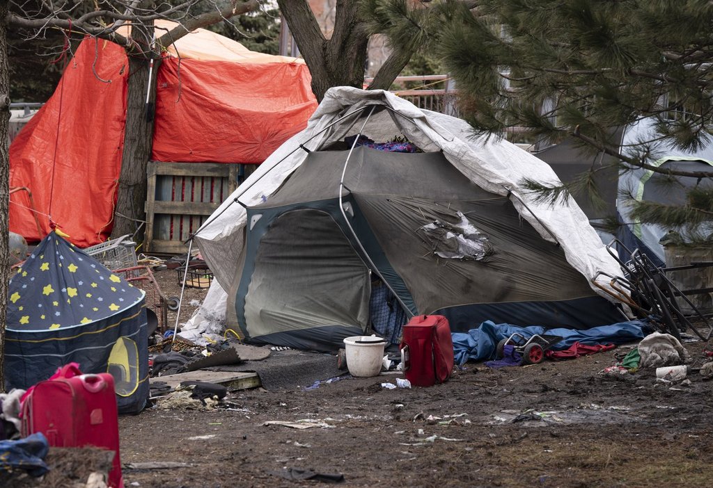 Tents are seen at an unhoused encampment in Montreal on Wednesday, April 1, 2026.  