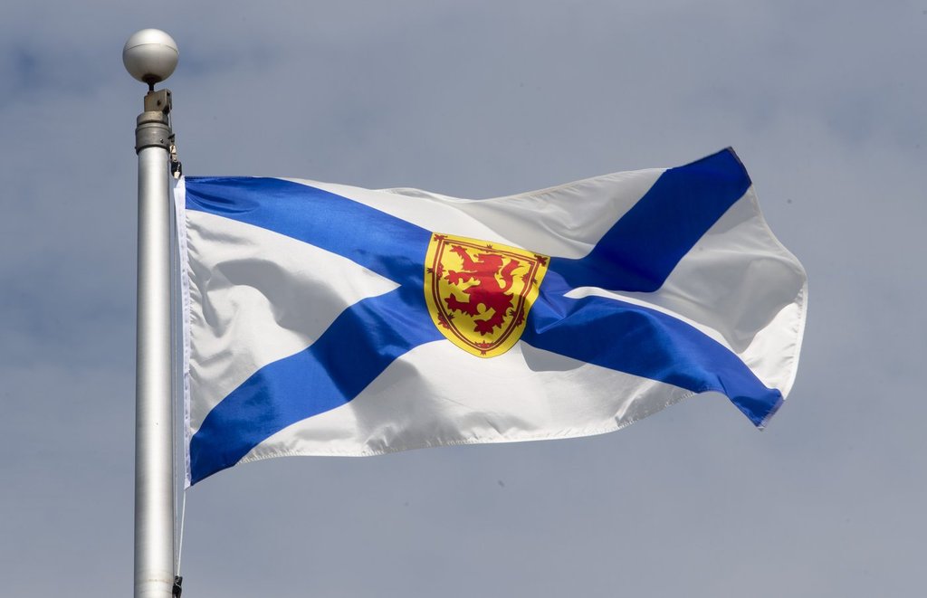 Nova Scotia's provincial flag flies on a flagpole in Ottawa on June 30, 2020. THE CANADIAN PRESS/Adrian Wyld.