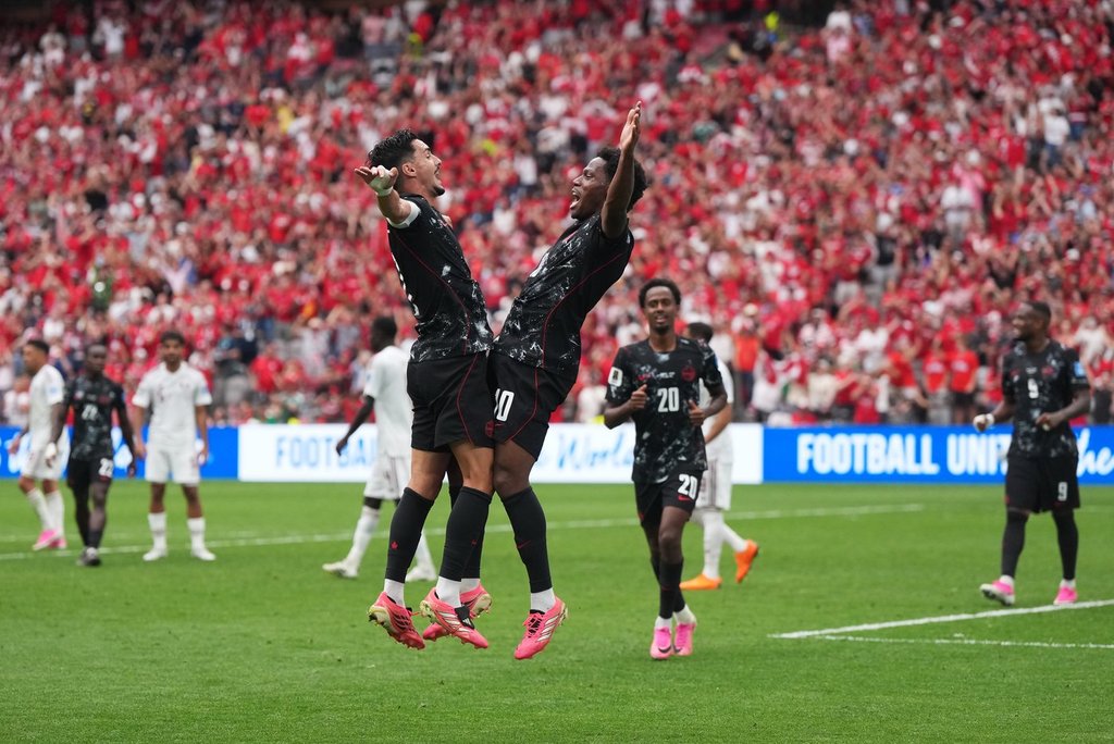 Canada’s Jonathan David (right) celebrates his goal against Qatar with Stephen Eustaquio (7) during the first half of a World Cup Group B soccer match, in Vancouver, on Thursday, June 18, 2026.