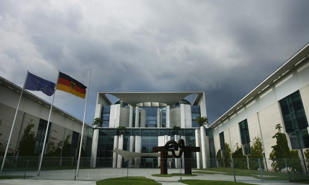 FILE – Dark clouds cover the sky over the frontside of the German Chancellery in Berlin, May 26, 2009.