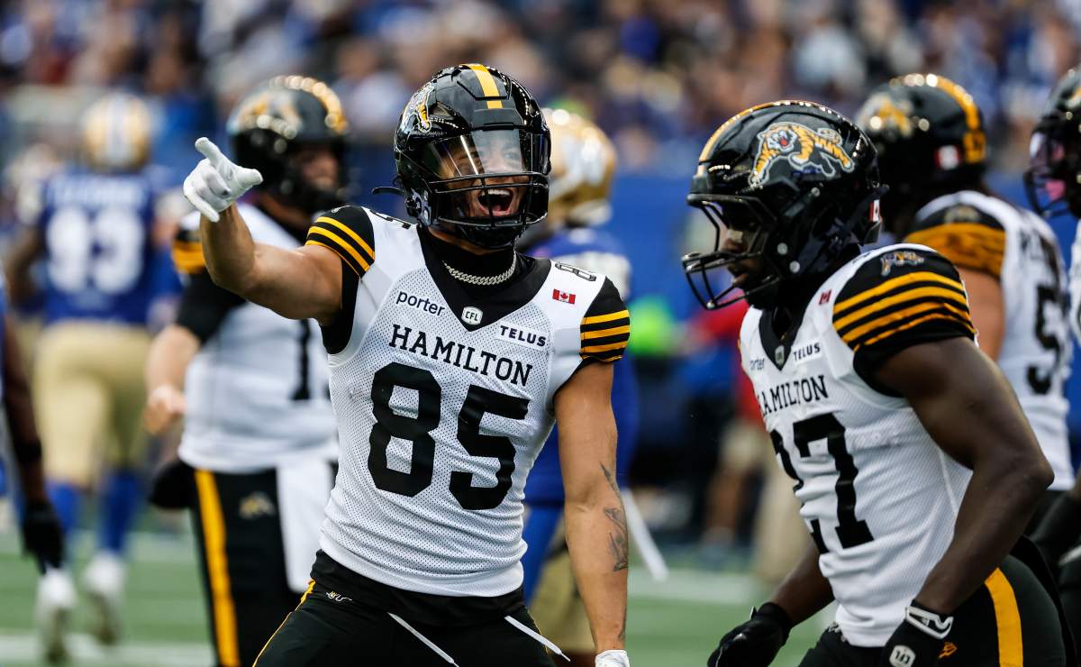 Hamilton Tiger-Cats' Kiondre Smith (85) celebrates his  touchdown against the Winnipeg Blue Bombers during first half CFL football action in Winnipeg on Thursday, June 11, 2026. THE CANADIAN PRESS/John Woods.