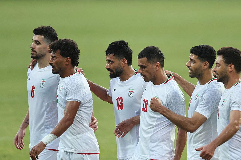 Iran's Forward #23 Ramin Rezaeian celebrates with teammates after scoring their side's second goal during an international friendly football match between Iran and Gambia, in Antalya, southern Turkey, May 29, 2026, as part of Iran's preparation for the upcoming football World Cup.