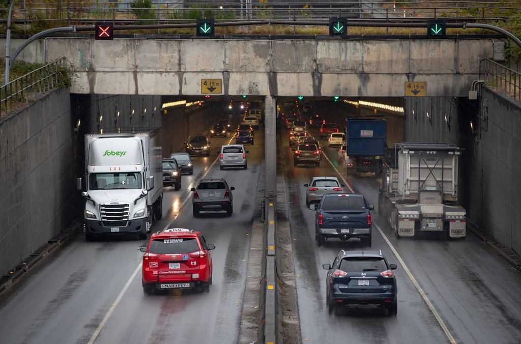 Motorists exit and enter the George Massey Tunnel in Richmond, B.C., on Friday, August 20, 2021. 
