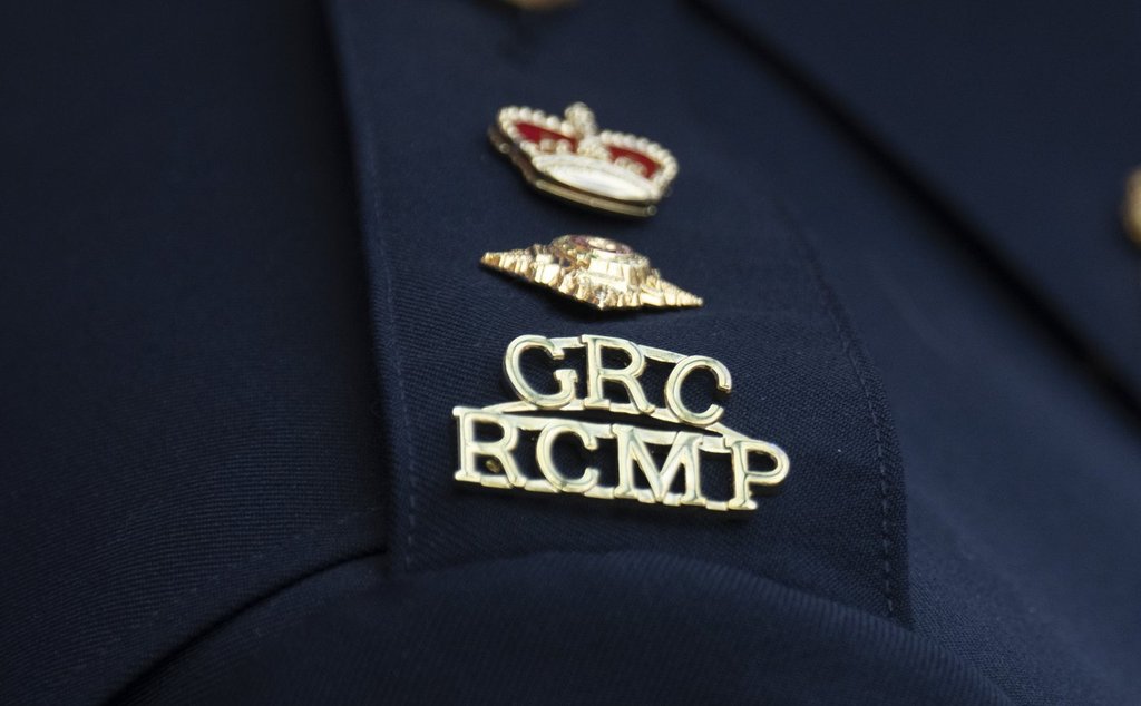 An RCMP logo is seen on the shoulder of a superintendent during a news conference in St. John's, N.L., on June 24, 2023.