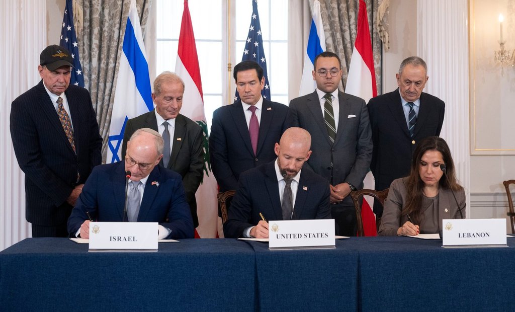 U.S. Secretary of State Marco Rubio and others watch, seated from left, Israel's Ambassador to the U.S. Yechiel Leiter, counselor Dan Holler, and Lebanon's Ambassador to the U.S. Nada Hamadeh, sign a framework agreement, described as a first step toward peace following months of conflict between Israel and the Lebanese militant group Hezbollah, at the State Department, Friday, June 26, 2026, in Washington. 