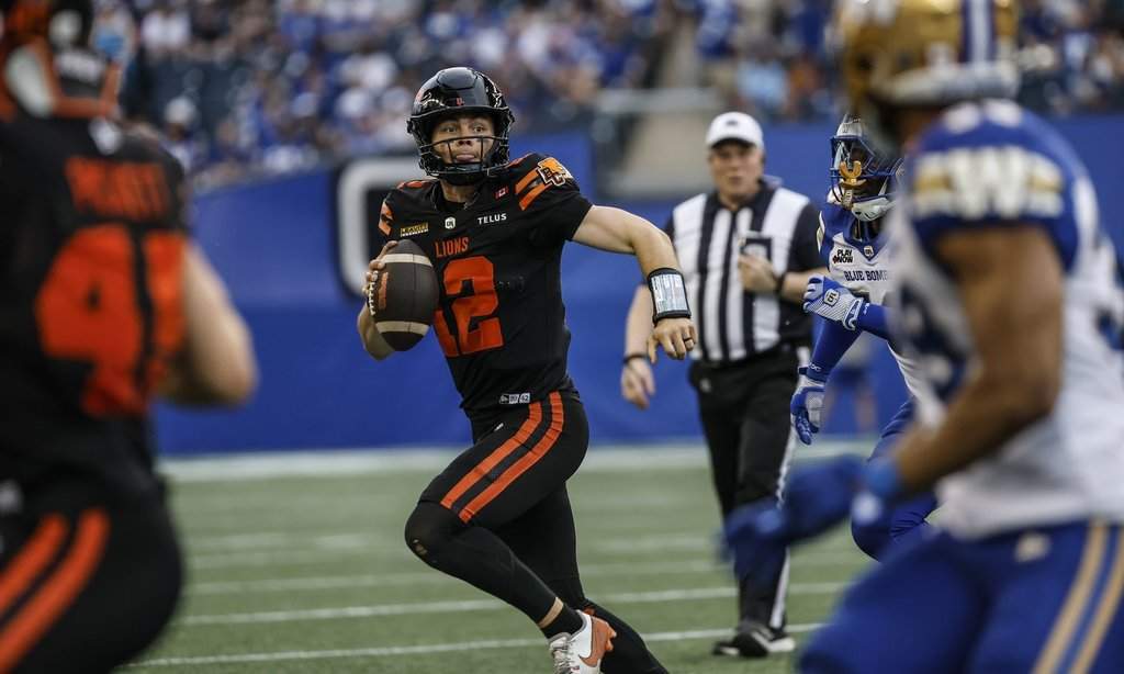 B.C. Lions quarterback Nathan Rourke (12) runs against the Winnipeg Blue Bombers during first half CFL pre-season football action in Winnipeg on Friday, May 29, 2026. THE CANADIAN PRESS/John Woods.