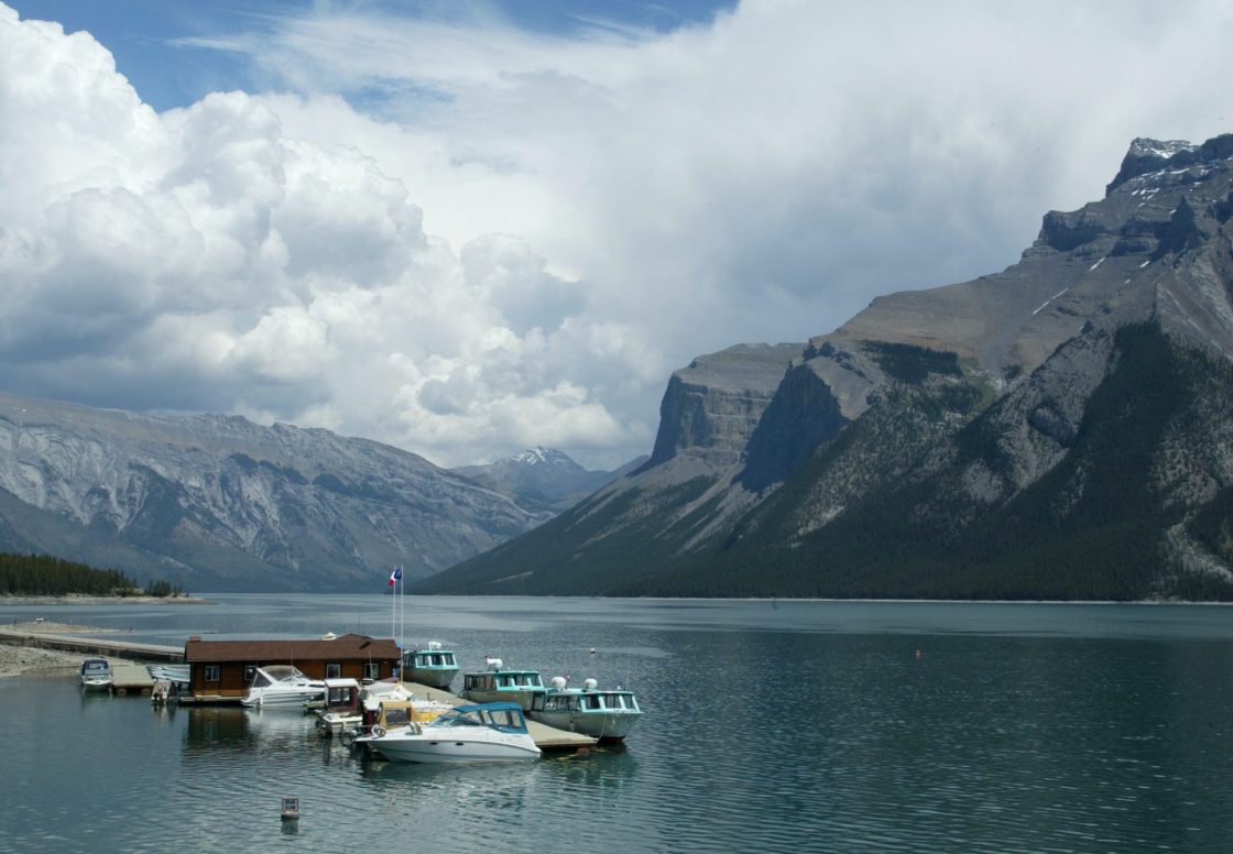 Boats sit anchored at the dock on Lake Minnewanka in Banff National Park near the town of Banff, Tuesday June 29, 2004.