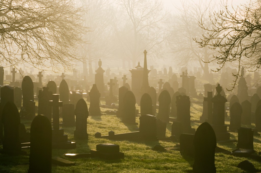A file photo of a low winter sunlight flooding through a misty cemetery in Stoke-on-Trent.