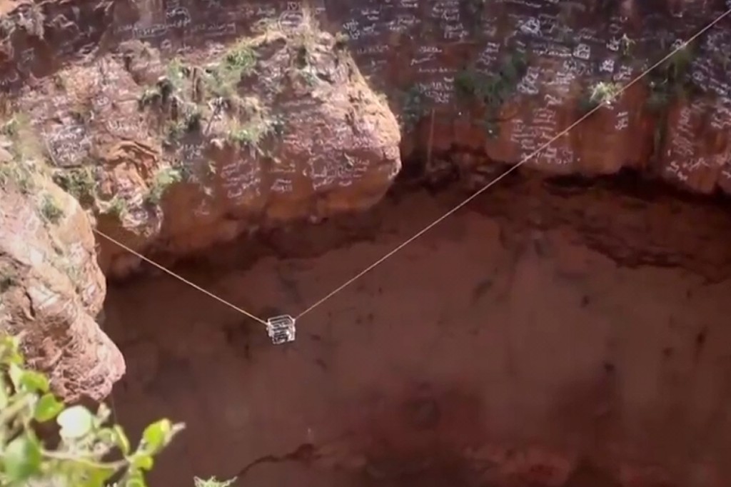 This screengrab from video, released by Yemeni Civil Defense Authority, shows rescuers removing the body of daredevil adventurer Al-Qaqa Ibn Antar on Saturday, June 13, 2026, after he had fallen into a volcanic crater in southern Yemen while climbing without safety equipment on Friday.