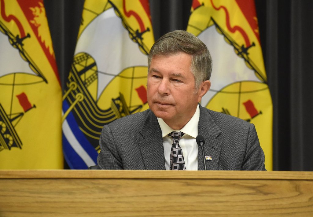 New Brunswick Health Minister Dr. John Dornan listens during a news conference in Fredericton on Wednesday April 29, 2026. THE CANADIAN PRESS/Eli Ridder.