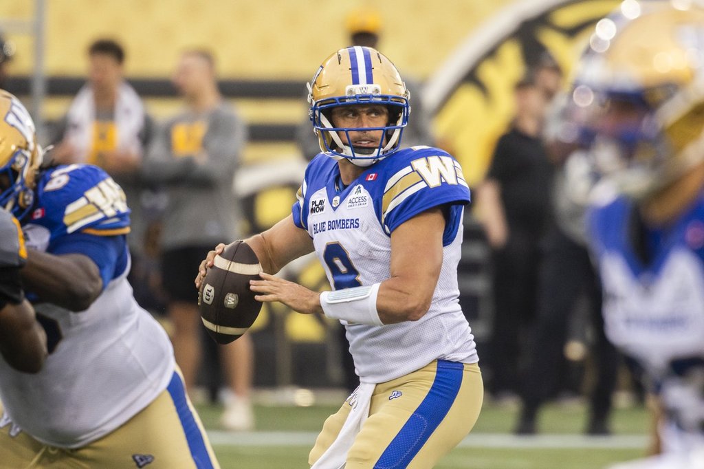 Winnipeg Blue Bombers quarterback Zach Collaros (8) looks for a pass during first half CFL football action against the Hamilton Tiger-Cats, in Hamilton on Sunday, July 5, 2026. 