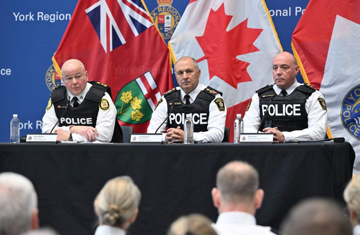 Toronto Police Service Chief Myron Demkiw, left, is joined by York Regional Police Chief Jim MacSween, centre, and YRP Deputy Chief Ryan Hogan at a press conference to announce the results of ‘Project South,’ a lengthy investigation into organized crime and corruption at York Regional police headquarters in Aurora, Ont., on Feb. 5, 2026.