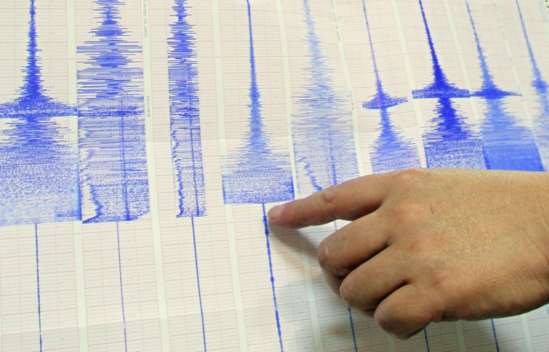 FILE -- An earthquake expert points to a seismographic reading recorded during an earthquake in 2010. 