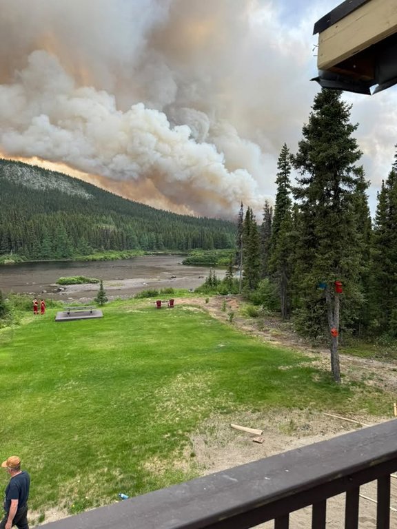 Smoke from a wildfire near a cabin area outside Labrador City, N.L., is shown in a June 29, 2026, handout photo. THE CANADIAN PRESS/Handout - Terry Spurrell (Mandatory Credit).