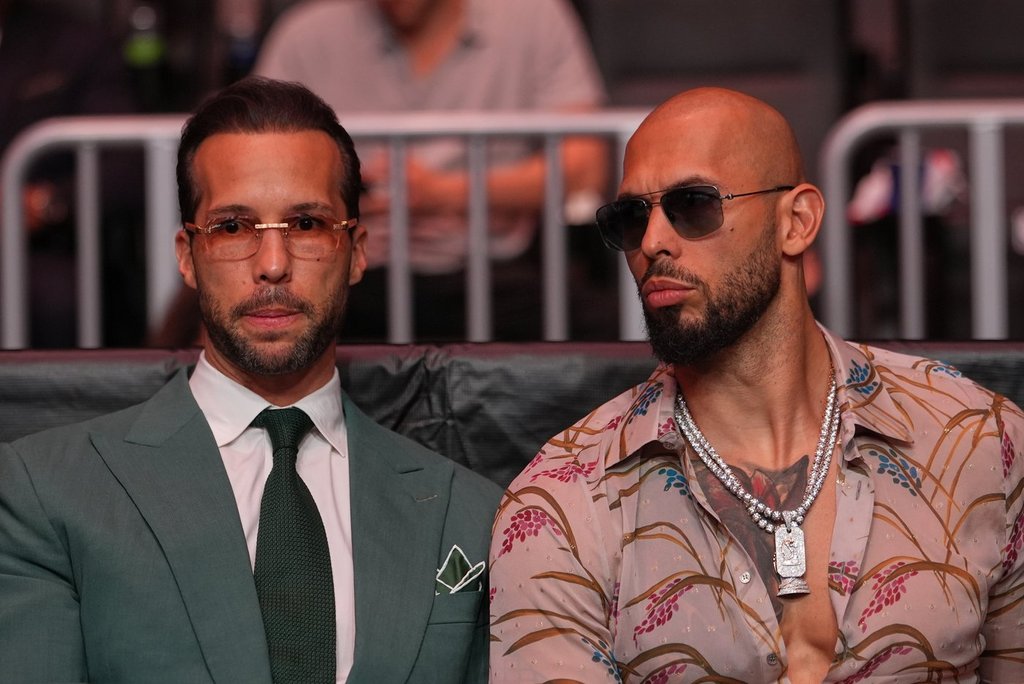 FILE - Andrew Tate, right, and his brother Tristan arrive an event, April 11, 2026, in Miami. 