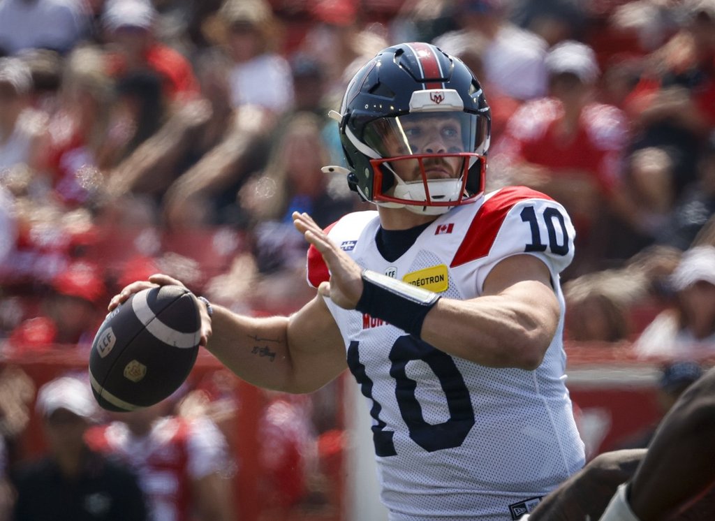 Montreal Alouettes quarterback Davis Alexander throws the football during first half CFL action against the Calgary Stampeders, in Calgary, Saturday, July 18, 2026. THE CANADIAN PRESS/Jeff McIntosh.