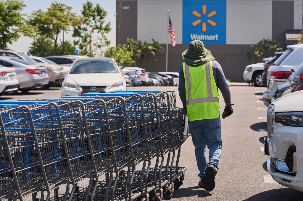 A file photo of empty shopping carts collected from the parking lot at Walmart store in Burbank, Calif., on Thursday, April 10, 2025.